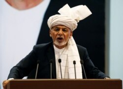 FILE - Afghanistan's President Ashraf Ghani speaks during a consultative grand assembly, known as Loya Jirga, in Kabul, Afghanistan, April 29, 2019.