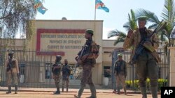 M23 rebels guard outside the South Kivu province administrative office, in the center of the eastern DRC's second-largest city, Bukavu, Feb. 16, 2025.