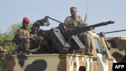 FILE - A convoy of Cameroonian soldiers reinforces its military front against Nigerian Islamist group Boko Haram.