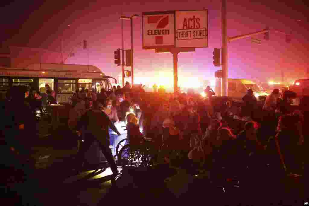 Residents of a senior center are evacuated as the Eaton Fire approaches, Jan. 7, 2025, in Altadena, California.