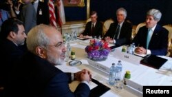 FILE - Secretary of State John Kerry (R) meets with Iran's Foreign Minister Mohammad Javad Zarif (L) during talks on Tehran's nuclear program in Vienna, July 13, 2014.