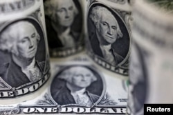 미화 1달러 화폐. 미국에서 대학 입학 전까지 양육비가 30만 달러가 넘는 것으로 나타났다.