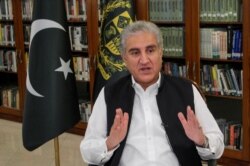Pakistan's Foreign Minister Shah Mehmood Qureshi gestures as he speaks during an interview with Reuters in Islamabad, Pakistan June 25, 2020.