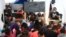 Volunteer teachers give class to children asylum seekers at a tent camp on the US border in Reynosa, Mexico. (Dylan Baddour/VOA)