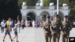 Polish soldiers take part in a changing of the guard at the Tomb of the Unknown Soldier at Pilsudski Square in Warsaw, Poland, Aug. 27, 2019. The square will be the site of commemorations Sunday marking the 80th anniversary of the start of World War II.