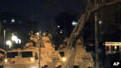 Egyptian army armored vehicles patrol a street in Cairo following protests in Cairo, Egypt, Jan 28, 2011