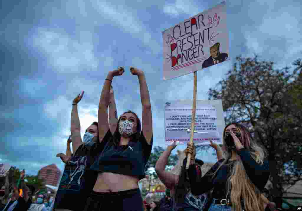 Demonstrators protest the death of George Floyd in downtown Albuquerque, N.M., May 31, 2020.