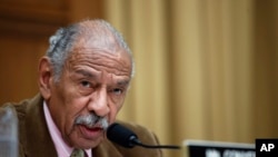 FILE- Rep. John Conyers, D-Mich., speaks during a hearing of the House Judiciary subcommittee on Capitol Hill in Washington, April 4, 2017.