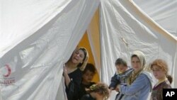 ជនភៀសខ្លួន​ស៊ីរី​ស្នាក់​នៅ​ក្នុង​ជំរំ​មួយ​ នៅ​ទី​ក្រុង​ប៊យនូយ៉ូ​គ្ហុន​ (Boynuyogun) ប្រទេស​ទួរគី​ ថ្ងៃ​ទី​១៤​ ខែ​មិថុនា​ ឆ្នាំ​២០១១។​