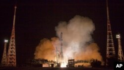 In this photo provided by Roscosmos Space Agency Press Service on Tuesday, July 10, 2018, Russian cargo ship Souz 2,1A takes off from the launch pad at Russia's main space facility in Baikonur, Kazakhstan. 