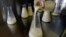FILE - A lab technician at the Mothers' Milk Bank of New England in Newtonville, Mass., pours donated breast milk into another flask to prepare for pasteurization. Kenya will soon be getting Africa's second bank for donated breast milk. 