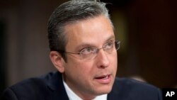 Puerto Rico Gov, Alejandro Javier Garcia Padilla testifies on Capitol Hill in Washington, Dec. 1, 2015, before the Senate Judiciary Committee hearing on Puerto Rico's fiscal problems.