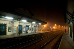 A man waits on the platform of the Louveciennes train station, west of Paris, Dec. 5, 2019. France dealt with nationwide strikes and protests over plans to overhaul the nation's pension system. Transport was hit especially hard.
