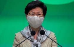 Hong Kong Chief Executive Carrie Lam listens to reporter's question during a press conference in Hong Kong, Tuesday, May 19, 2020.