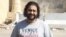 Egyptian pro-democracy activist Alla Abdel Fattah was barred from the court session where he was sentenced to 15 years in prison for protesting a restrictive protest law, Cairo, June 11, 2014. (Hamada Elrasam/VOA) 