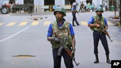Sri Lankan Naval soldiers stand guard outside St. Anthony's Church in Colombo, Sri Lanka, April 29, 2019. 