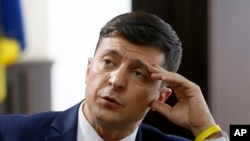 Ukrainian comedian Volodymyr Zelenskiy, who played the nation's president in a popular TV series, and is running for president in next month's election, is photographed on the set of a movie, in Kiev, Ukraine, Wednesday, Feb. 6, 2019. 