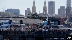 FILE - Spectators at Pier 39 watch an America's Cup sailing event in San Francisco, Sept. 18, 2013. The FBI said Dec. 22, 2017, that it had found a martyrdom letter and several guns in the home of a former Marine who may have been planning a Christmas Day attack on a popular San Francisco tourist destination.