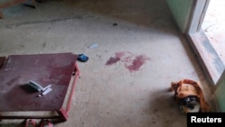 FILE - A child's backpack and sandals are seen at a local school damaged by an air attack carried out by the Myanmar military against the People Defense Force, in Sagaing, Myanmar, Sept. 16, 2022 in this social media video still image obtained by Reuters.