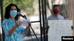 FILE - Rushan Abbas, executive director of the Campaign for Uyghurs, speaks to a group gathered near the White House to call on the U.S. government to respond to China's alleged abuses of its Uyghur Muslim minority, July 3, 2020.