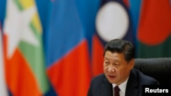 លោក​ប្រធានាធិបតី​ចិន ស៊ី ជីន​ពីង ថ្លែង​នៅ​ក្នុង​កិច្ចសន្ទនា​ស្តីអំពី​ការពង្រឹង​ទំនាក់ទំនង​ដៃគូ​ដែល​ធ្វើ​ឡើង​នៅ​ផ្ទះ​សំណាក់​របស់​រដ្ឋ Diaoyutai ក្នុង​ទីក្រុង​ប៉េកាំង នៅ​ថ្ងៃទី៨ ខែវិច្ឆិកា​ឆ្នាំ២០១៤។