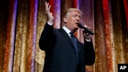 President-elect Donald Trump speaks during the presidential inaugural Chairman's Global Dinner, Jan. 17, 2017, in Washington.