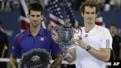 Astronaut Mike Hopkins and Astronaut Rick Mastracchio replace a faulty pump on the International Space Station during a spacewalk, Dec. 24, 2013.