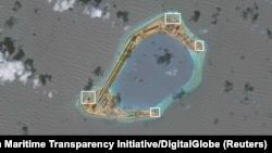 A satellite image shows what the Asia Maritime Transparency Initiative says appear to be anti-aircraft guns and what are likely to be close-in weapons systems (CIWS) on the artificial island Subi Reef in the South China Sea in this image released on Dec. 13, 2016.