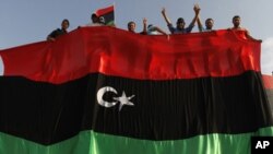 Libyan protesters attend a rally against Moammar Gadhafi in Misrata, July 6, 2011