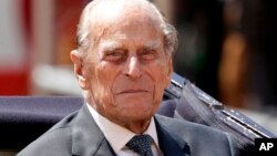 FILE - Britain's Prince Philip is seen sitting in a carriage in London, July 12, 2017.