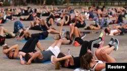 Health experts say it is important to stay active. Here, people come together for a public exercise event in Nantes, France, Sept. 2017. (REUTERS/Stephane Mahe)