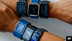 Clockwise, from top left are the: Garmin Vivoactive, Fitbit Blaze, Garmin Vivoactive HR, Samsung Gear Fit2, Apple Watch and Fitbit Surge. A recent study from the Stanford University School of Medicine says fitness trackers are not accurate at tracking calories. (AP Photo/Bebeto Matthews)