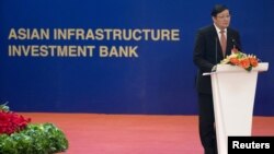 Chinese Finance Minister Lou Jiwei speaks at the inaugural meeting of the Board of Governors of the Asian Infrastructure Investment Bank in Beijing, China, Jan. 16, 2016.