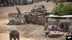 FILE - A view of damage including mosque on parts of the historic district of the mainly Kurdish city of Diyarbakir, southeastern Turkey, May 22, 2016. Turkey's military says on June 5, 2016, its forces have killed 27 Kurdish rebels in Hakkari province near the Turkish border with Iraq and Iran.