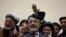 Afghan presidential candidate Abdullah Abdullah, center, addresses the media following a meeting with his party members, in Kabul, Afghanistan, Feb. 18, 2020.