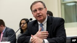 FILE - Acting Drug Enforcement Administration (DEA) Administrator Chuck Rosenberg talks before he testifies on Capitol Hill in Washington, March 22, 2016. 