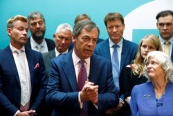 FILE - Leader of the Brexit Party Nigel Farage speaks at a news conference in London, May 27, 2019.