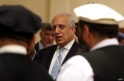 FILE - U.S. Special Representative for Afghanistan Reconciliation Zalmay Khalilzad attends the Intra Afghan Dialogue talks in the Qatari capital, Doha, July 8, 2019.