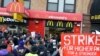 A coalition of groups rally in front of a McDonald's on East 125th Street and Lexington Avenue in Harlem during a protest by fast food workers and supporters for higher wages in New York, Apr. 4, 2013.