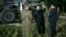 In this image made from video by North Korea's KRT, July 28, 2017, North Korean leader Kim Jong Un gestures at the site of a missile test at an undisclosed location in North Korea.