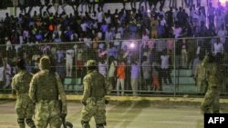 FILE - Somali security forces patrol during a soccer match at Konis Stadium, in Modadishu, Somalia, Sept. 8, 2017. 
