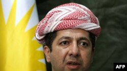 Masrour Barzani, kanselir Dewan Keamanan Regional Kurdistan berbicara selama konferensi pers di Provinsi Kurdi Dohuk, Irak, 18 Desember 2014. (Foto: AFP)