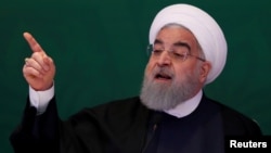 Iranian President Hassan Rouhani spoke on state television to say Iran might seek to stay in the nuclear deal that has reduced sanctions on his country even if the U.S. withdraws from it. In this picture, he is speaking earlier this year. 