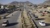 Vehicles cross on newly- constructed Darul Aman street in Kabul, Afghanistan, April 21, 2011