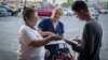 A volunteer helps to register eligible voters in Las Vegas, Nevada, ahead of the November midterm election.