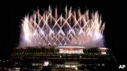 Fireworks illuminate over the National Stadium during the opening ceremony of the 2020 Summer Olympics, Friday, July 23, 2021, in Tokyo. (AP Photo/Shuji Kajiyama)