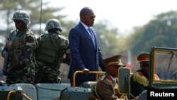 FILE - Burundi's President Pierre Nkurunziza arrives for the celebrations to mark Burundi's 55th anniversary of independence at the Prince Louis Rwagasore stadium in Bujumbura, Burundi, July 1, 2017.