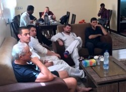 A picture obtained from Iranian news agency Tasnim on June 14, 2019, shows what Iran said were crew from an oil tanker hit in a suspected attack in the Gulf of Oman, in Bandar-e-Jask, Iran.