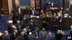 FILE - Senators are seen debating on the Senate floor on Capitol Hill in Washington, Feb. 10, 2021. (Senate Television via AP)