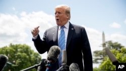FILE - President Donald Trump speaks to members of the media on the South Lawn of the White House in Washington, May 14, 2019.
